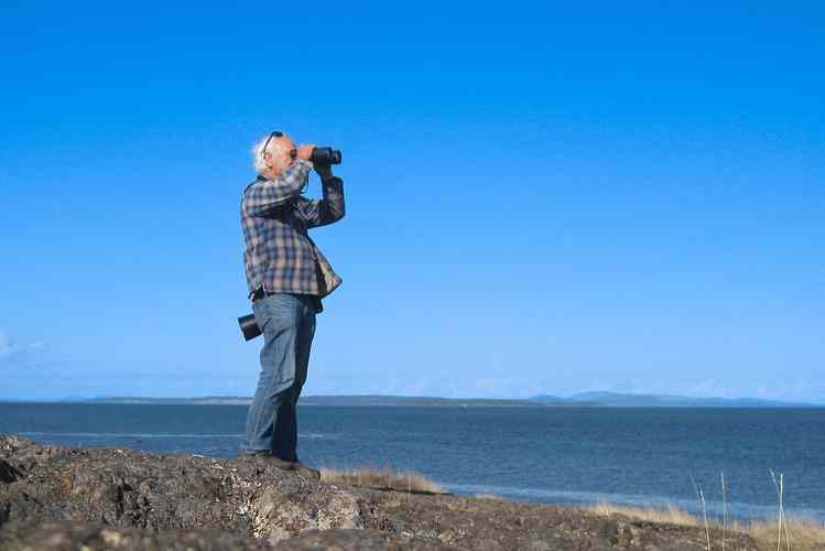 Angler using waterproof binoculars