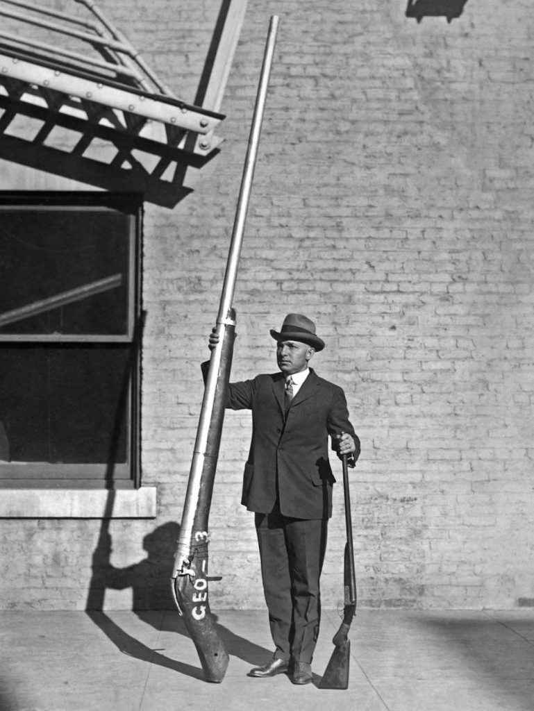 George A. Lloyd holding a Punt Gun