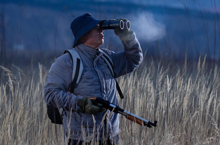 Hunter holding a Nikon binocular