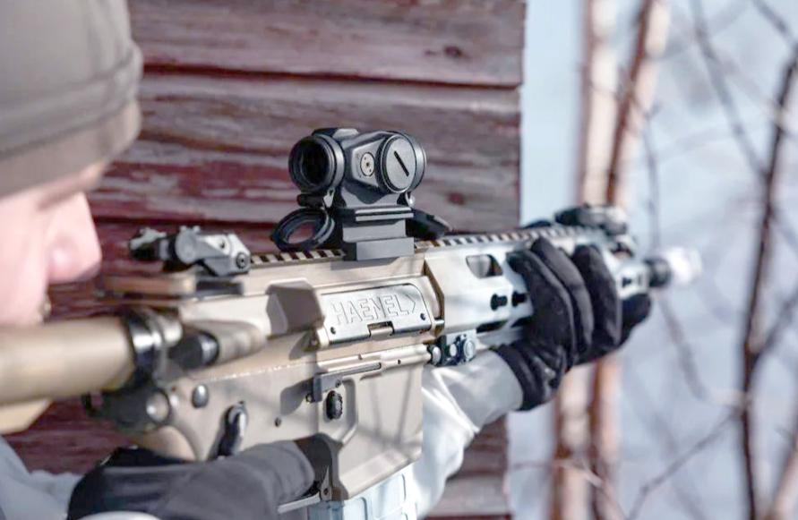A red dot sight mounted in a low position