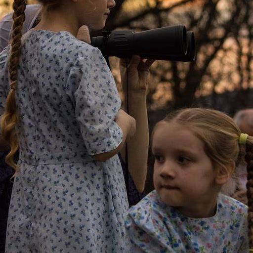 Children use binoculars in outdoors