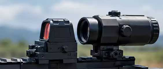 Red dot sight mounted with a magnifier on a rifle rail